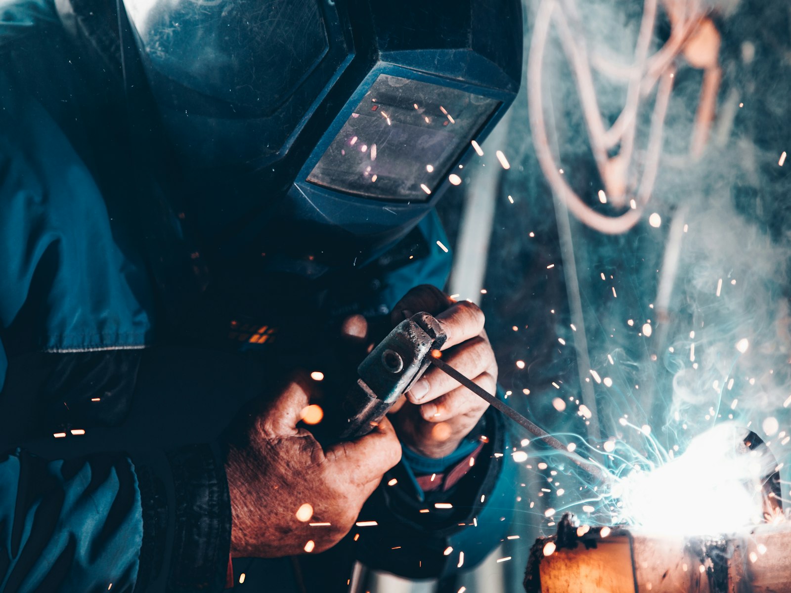 Technician working on metal pipework